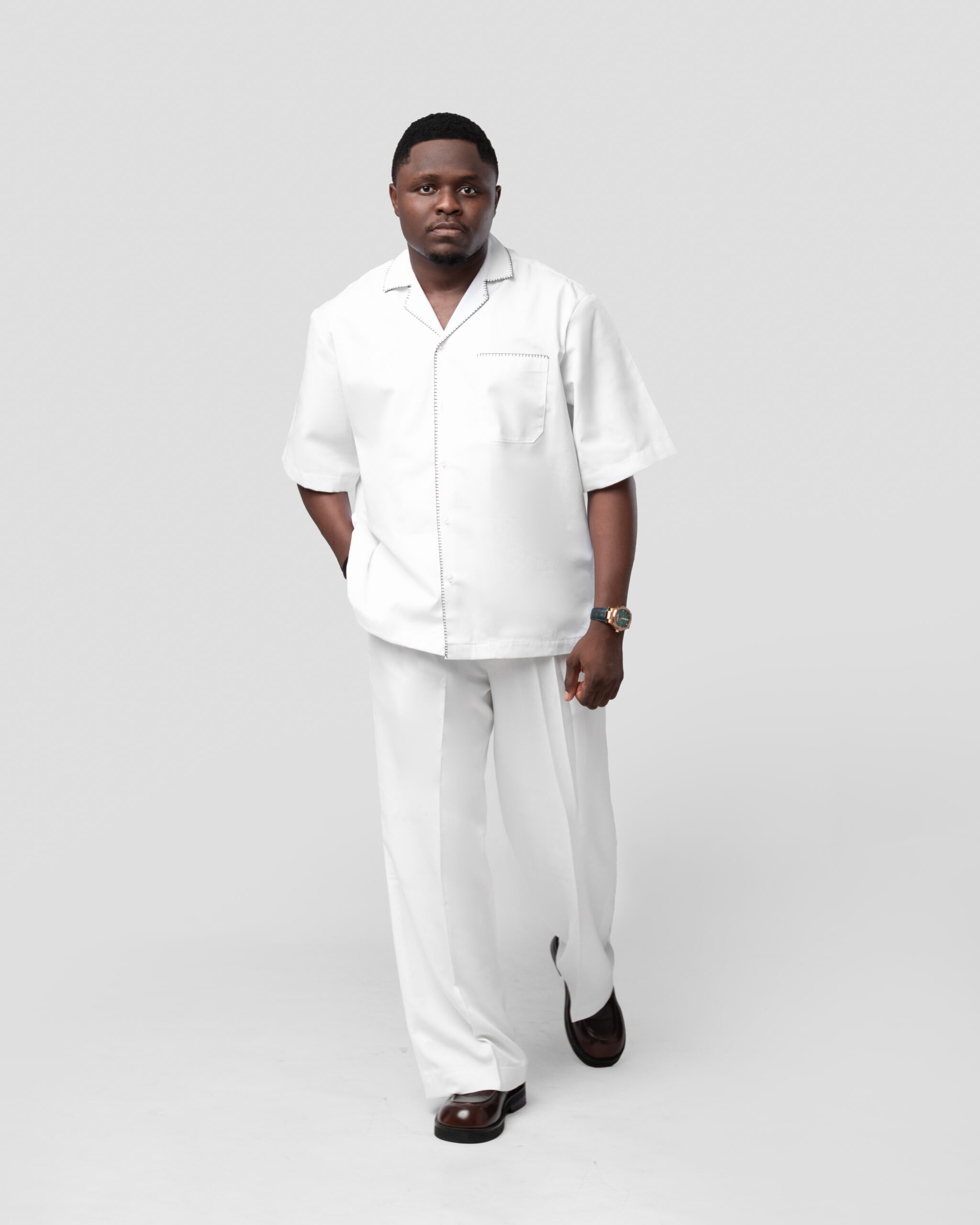 Off-white Pants paired with Black or White Subtle Embroidered Button-down Shirt